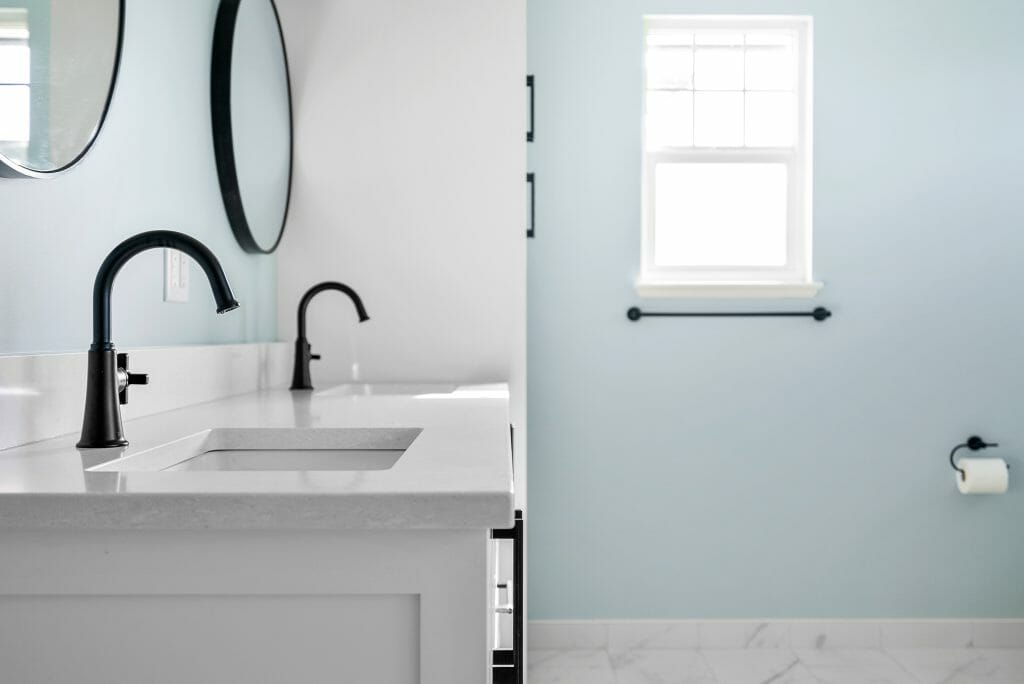Side view of a renovated bathroom countertop and cabinets.