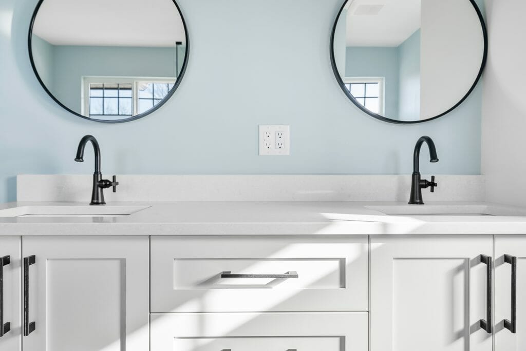Front view of a custom bathroom renovation with a double sink.