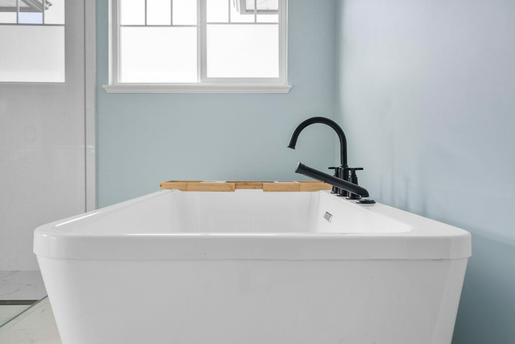 Closeup of a large white bathroom soaker tub.