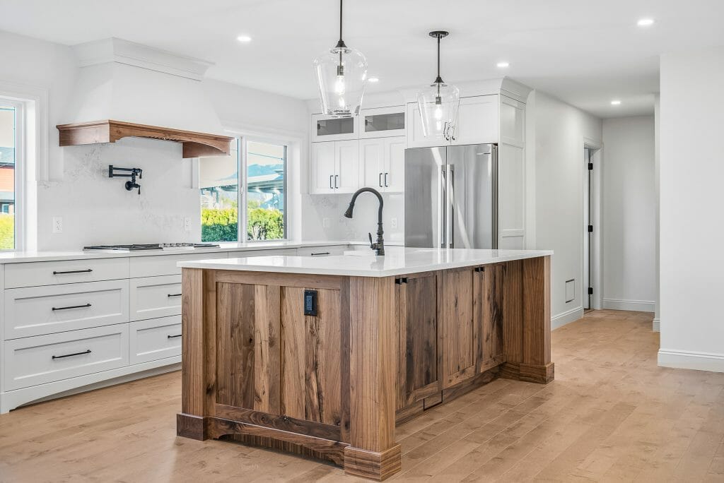 Full view of a newly renovated kitchen and kitchen island.
